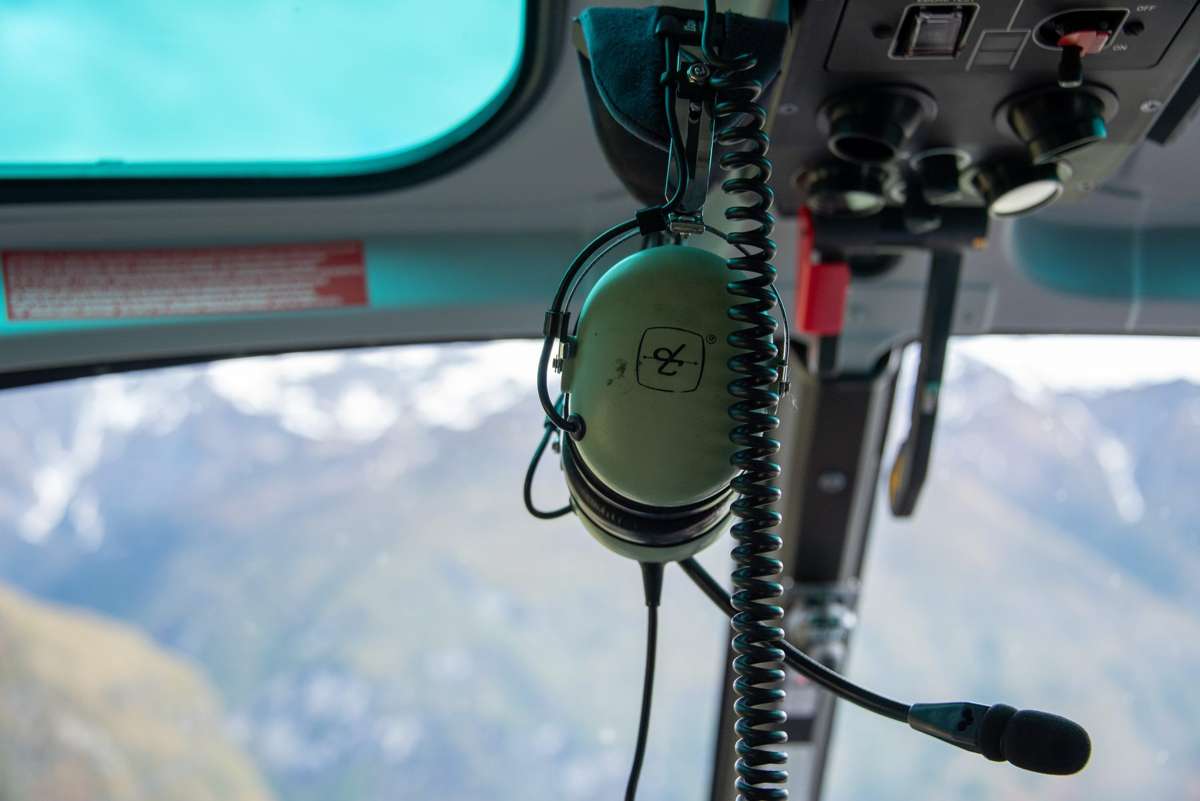 Helicopter cockpit view over snow-covered peaks on the Glacier Jet flight, Mount Aspiring National Park