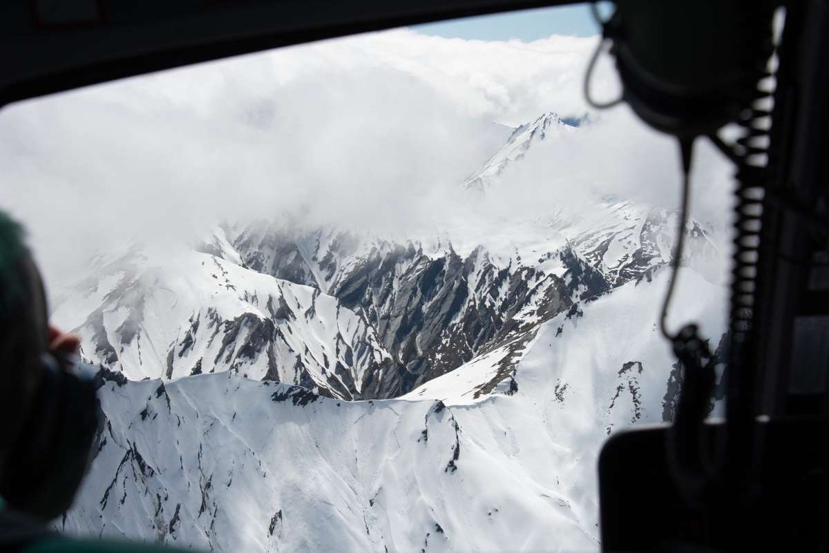 Snow-capped ridgeline from the helicopter door above Mount Aspiring National Park