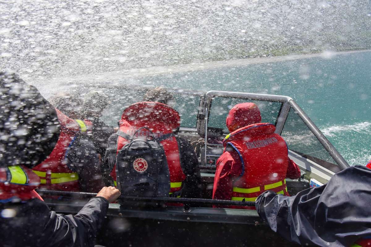 Jet boat spray as guests spin on the Matukituki River