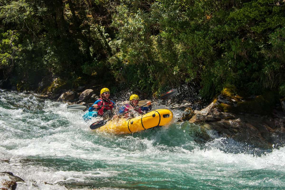 Packrafter paddling a rapid on the Matukituki River, Packraft Wanaka trip