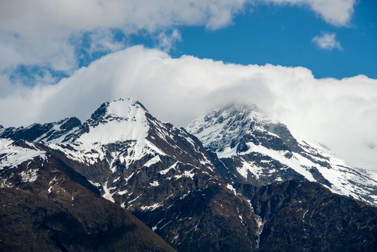 The summit of Tititea Mt Aspiring in cloud at the head of the Matukituki Valley